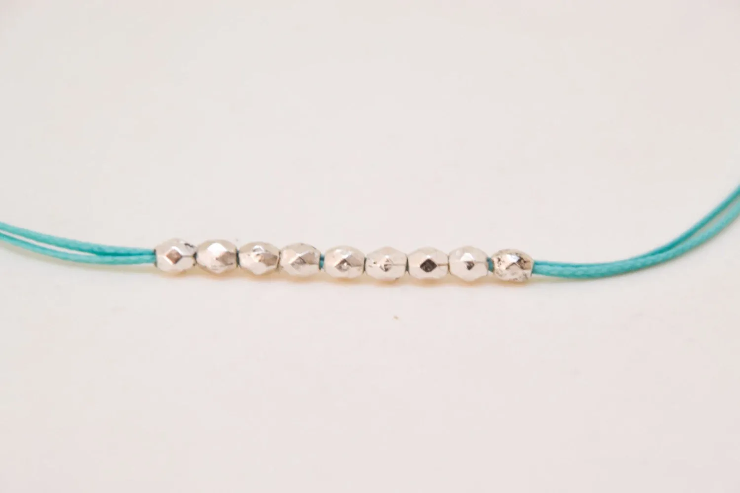 Silver beads bracelet, turquoise cord