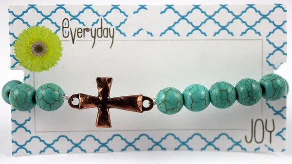 Turquoise beaded bracelet with Copper toned Hammered Cross Charm